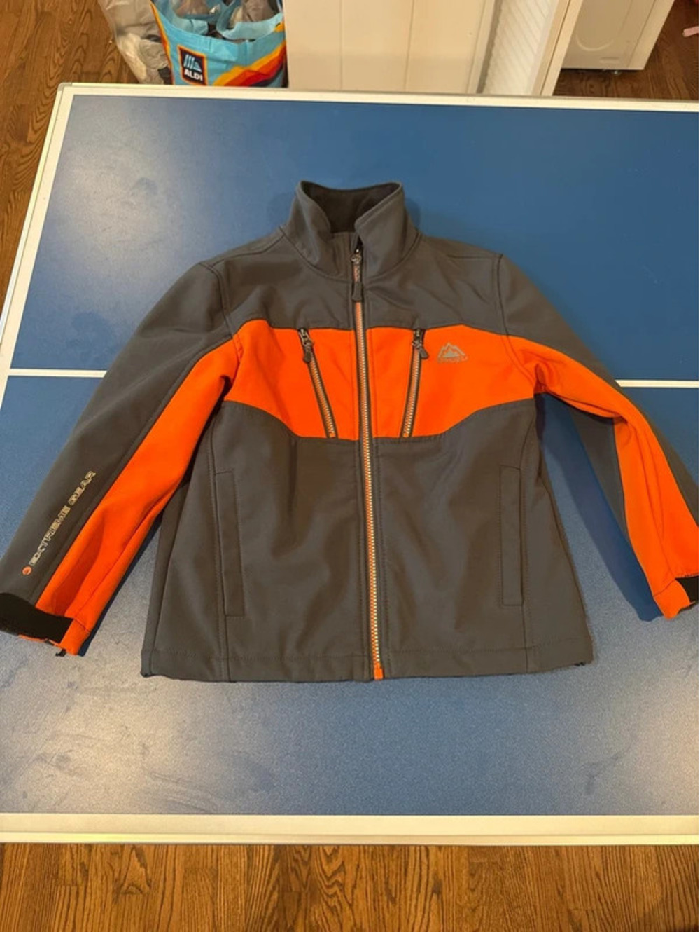 Orange and grey performance jacket by Snozu